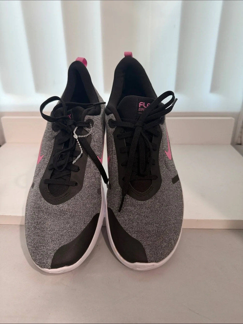 Nike Women's Gray Athletic Sneakers with Pink Swoosh